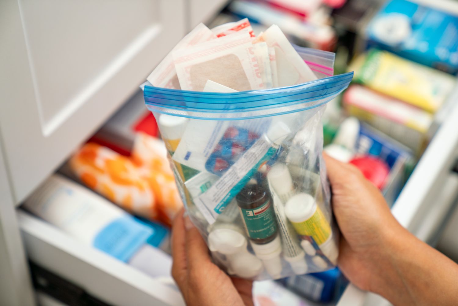 The bathroom drawer has been tidied up and stocked with new medical supplies.