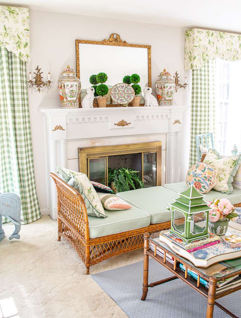 A room featuring a charming blend of white and green in a vintage-inspired style.