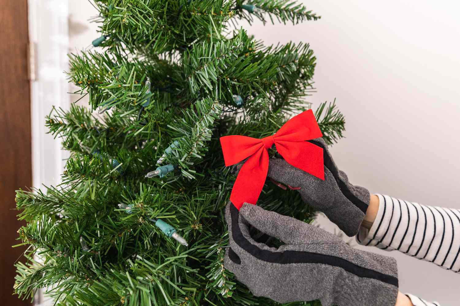 Adorning the Christmas tree with decorations