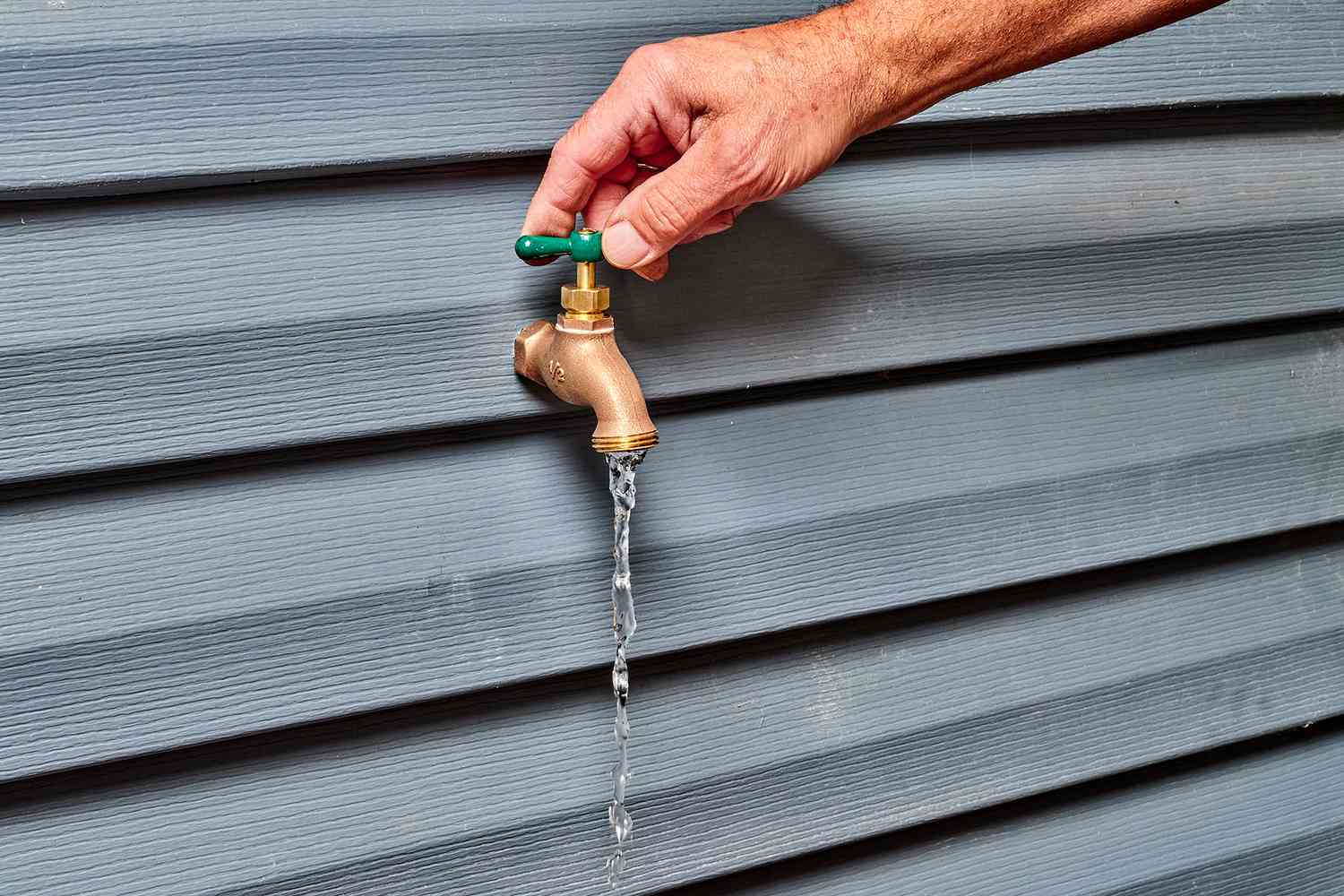 The green handle was rotated to check the water flow from the tap.