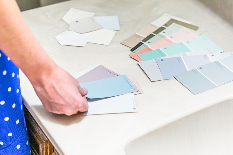 individual examining color samples