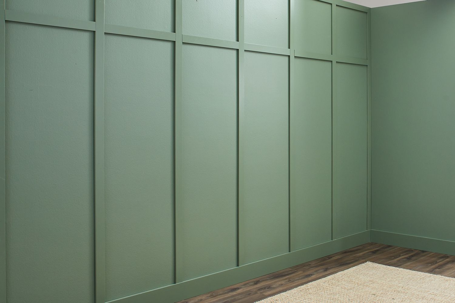 A side perspective of a wall coated in a soft sage eggshell finish.